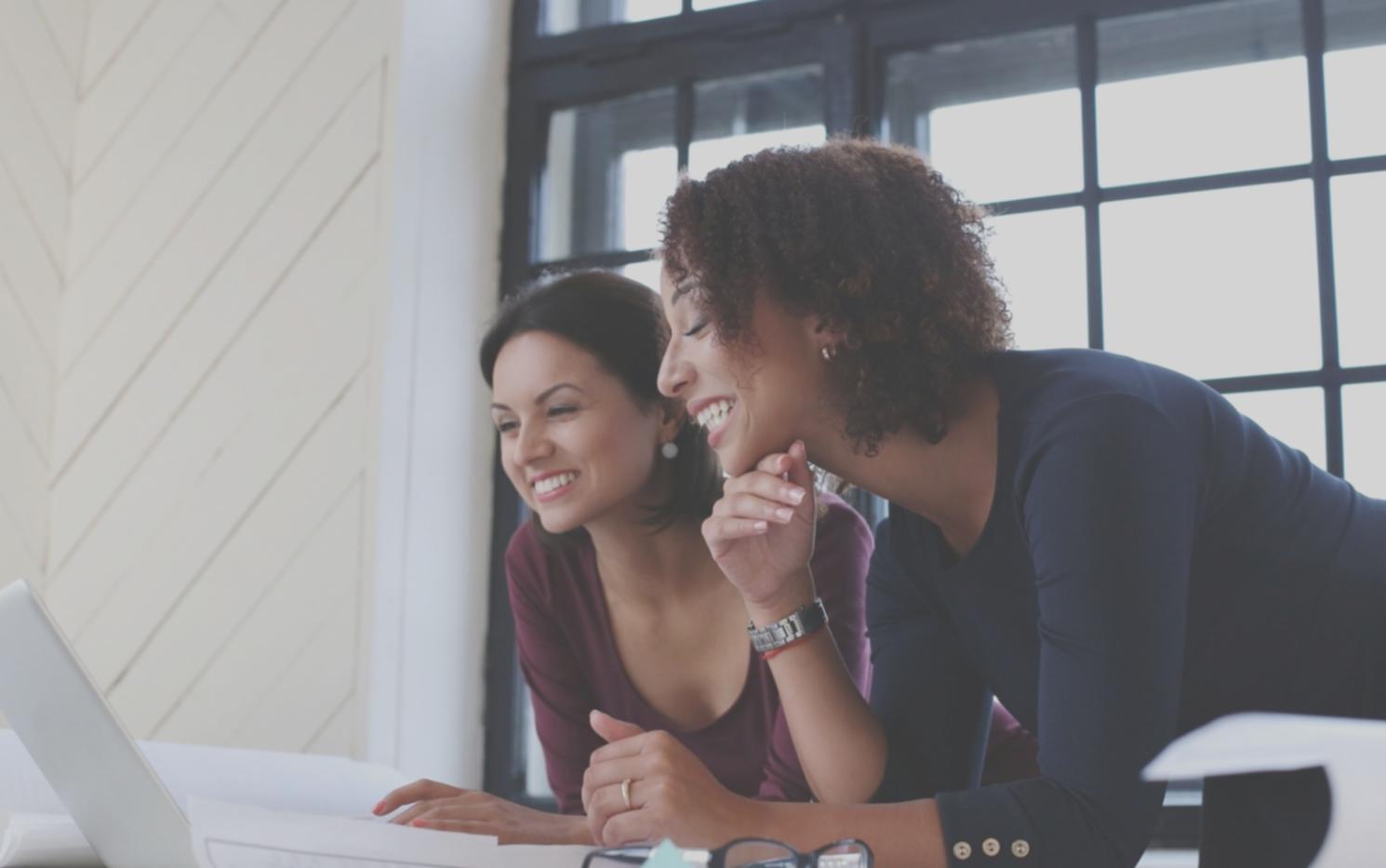 Well-organized home study setup with financial documents and laptop